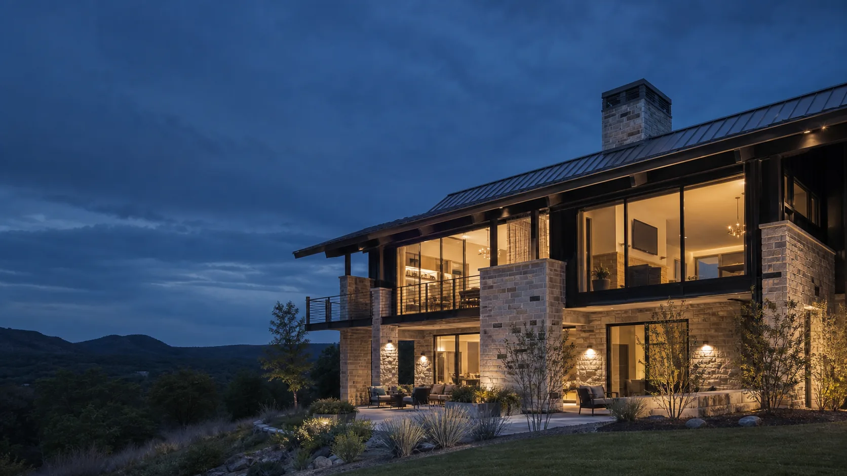 Modern Northwest Arkansas home with integrated exterior and interior lighting at dusk
